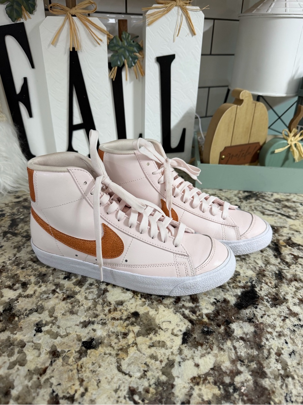 Nike High-Top Sneakers in Light Pink with Brown Swoosh